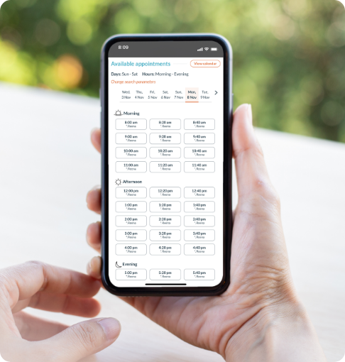 Closeup of patient choosing an appointment from a calendar using smart scheduling