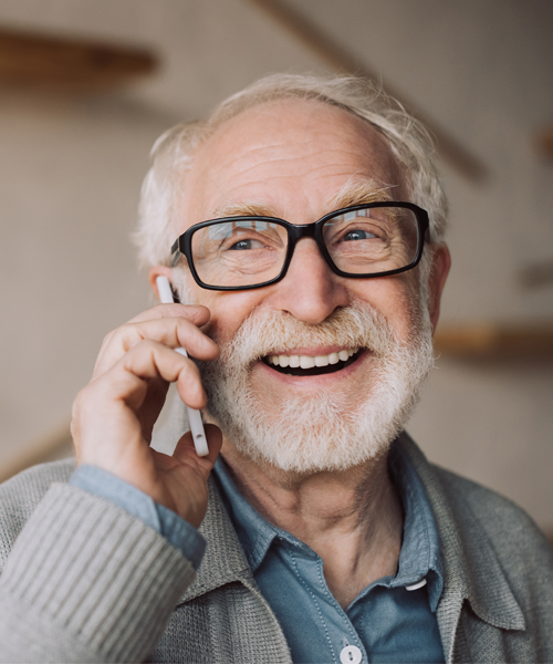 Elderly man checking appointment reminder on phone
