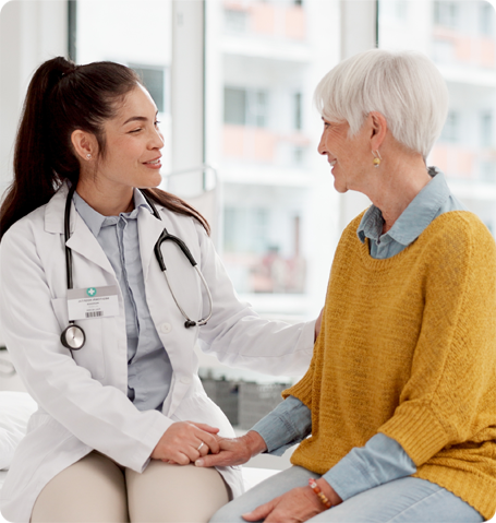 Doctor and elderly patient talking about healthcare