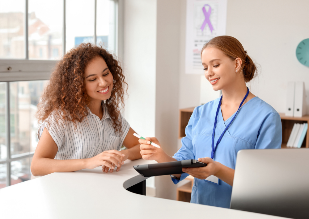 Patient and practioner looking over an iPad