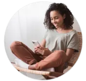 Woman sitting on chair and looking at phone